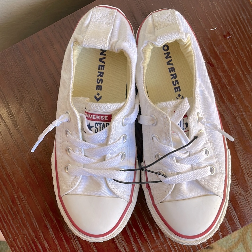 Girl Kids size 13 white slip on converse look like they’ve never even been worn.
